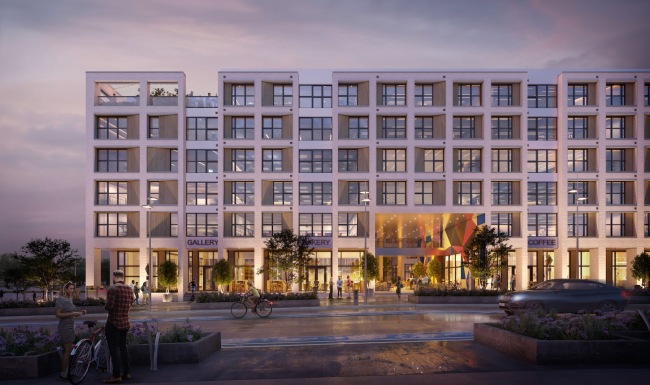 the front of a multi-story building with a street and people in front of it